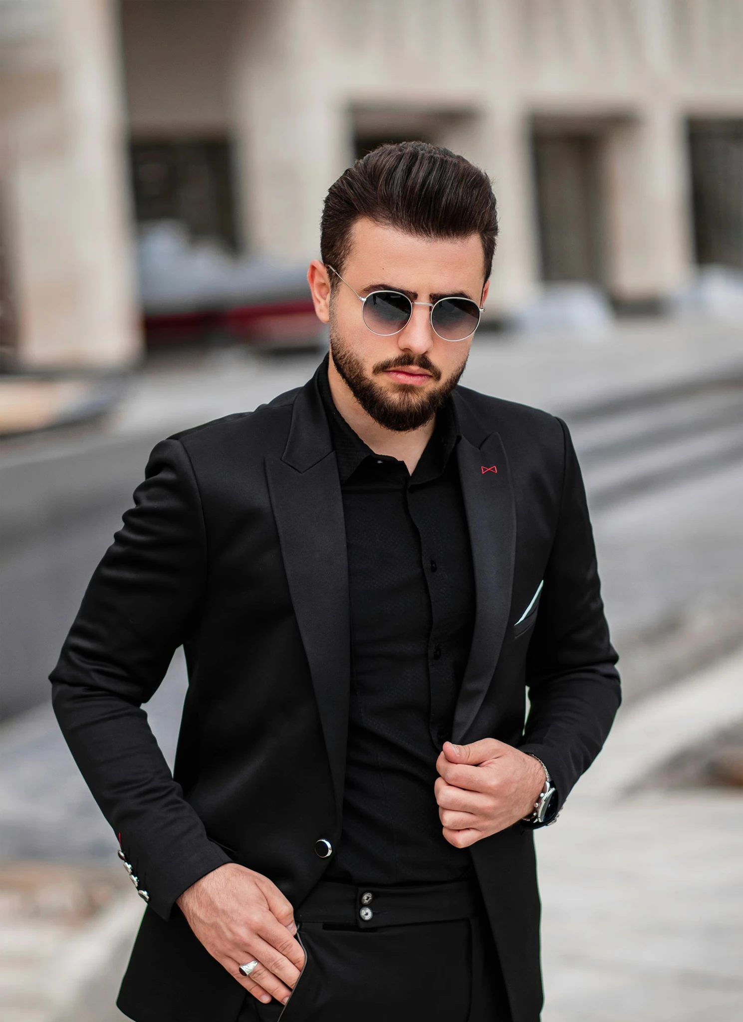 man in black suit jacket and black sunglasses